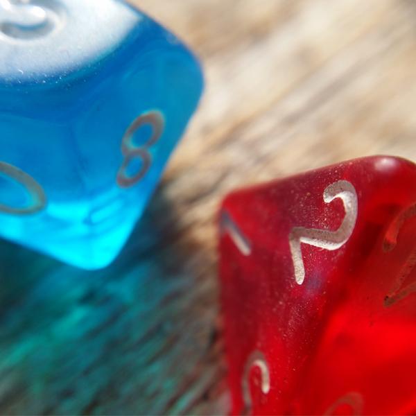 Dungeon and Dragon dice held in a hand