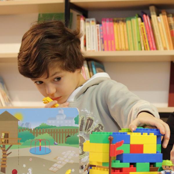 Boy playing with Legos®