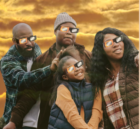 Family of 4 with eclipse glasses